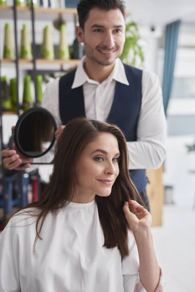 Hairdresser and female customer in hair salon